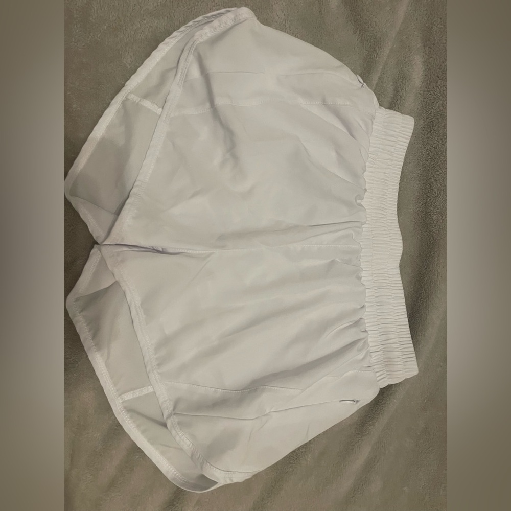 Lululemon track that shorts whitest in the color white
- lululemon size 4
